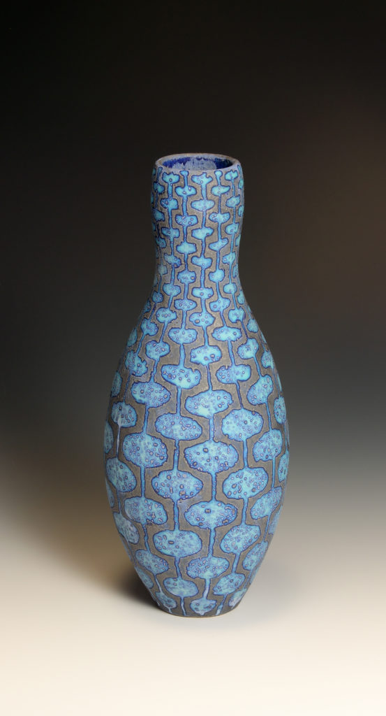 Dark-blue-vessel-with-geometric-pattern-28cm-h-10-cm-diam